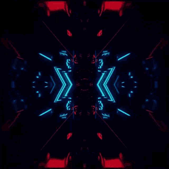 a kaleidoscope of red , blue and white lights on a black background .
