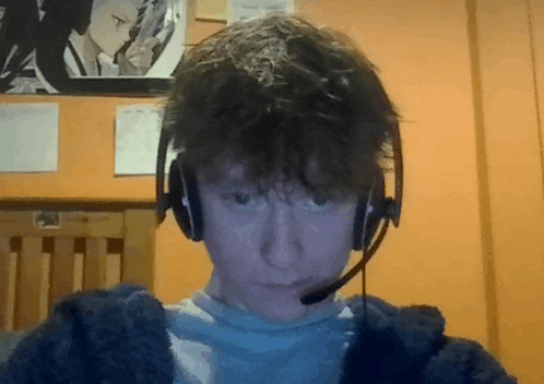 a young man wearing headphones and a microphone