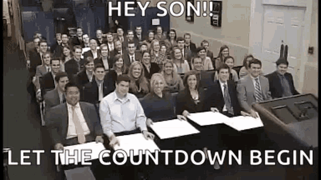 a large group of people are sitting in a room with the words hey son let the countdown begin