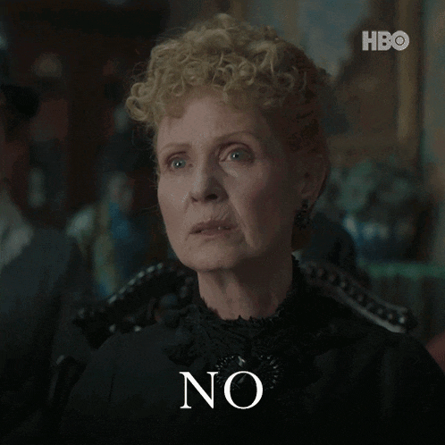 a woman in a black dress says " no "