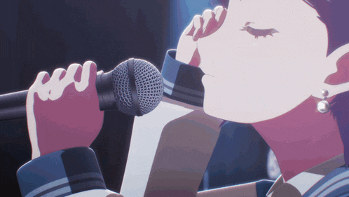 a close up of a person singing into a microphone with their eyes closed
