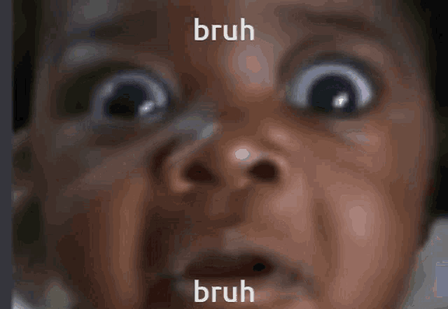 a close up of a baby 's face with bruh written on the bottom right