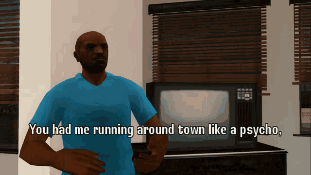 a man in a blue shirt is standing in front of a television and says you had me running around town like a psycho