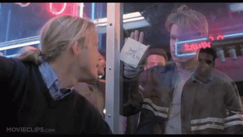 a movie clip from movieclips.com shows two men standing in front of a window