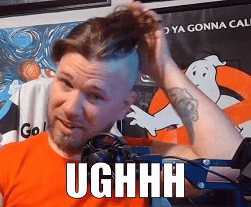 a man holds his hair in front of a ghostbusters poster and says ughhh