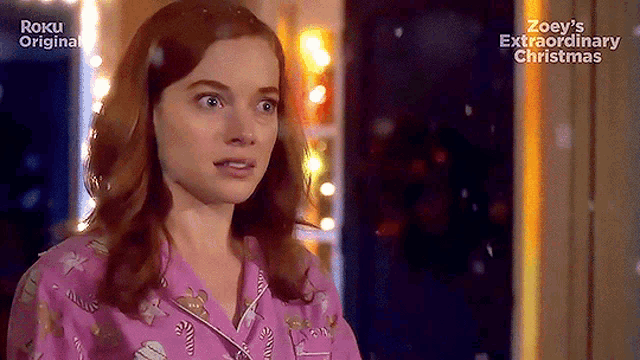 a woman in a pink pajama top is featured in a roku original advertisement for zoey 's extraordinary christmas