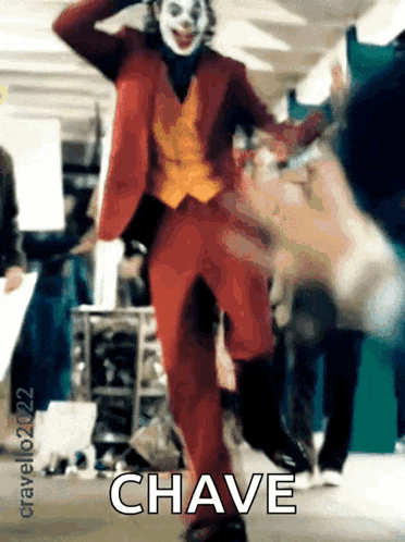 a man in a joker costume is dancing with the word chave written on the bottom