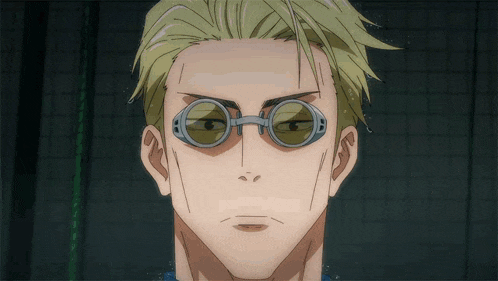 a close up of a man wearing a pair of glasses