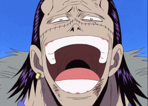 a close up of a person 's face with their mouth open