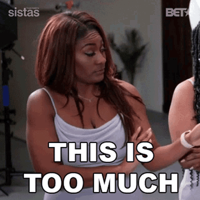 a woman is standing with her arms crossed and says this is too much