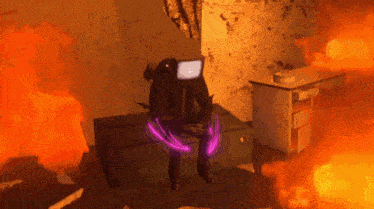 a person with a tv on their head is sitting in a room with fire