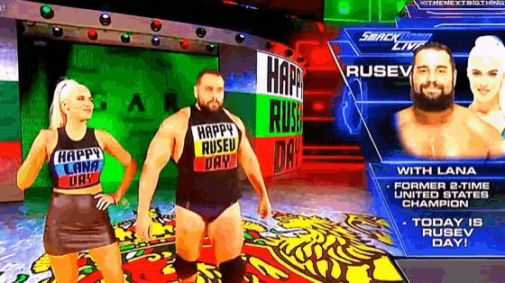 a man and a woman are standing in front of a sign that says happy rused day