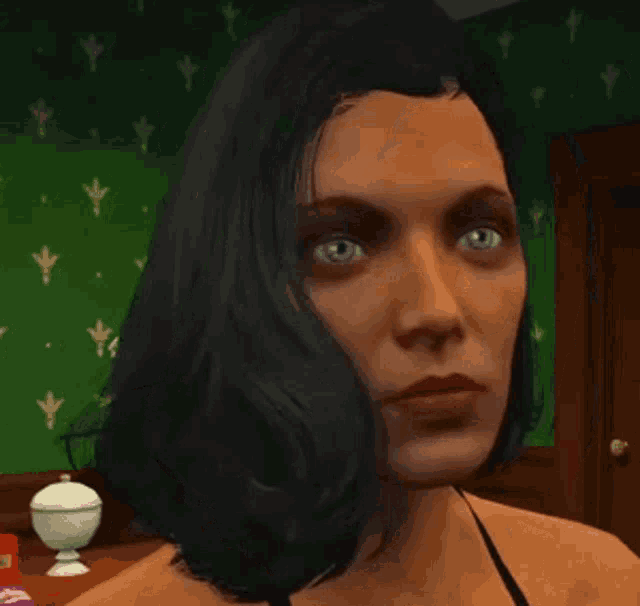 a close up of a woman 's face with a green wall in the background