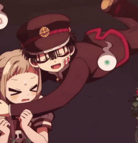 a boy and a girl are hugging each other in a dark room with ghosts around them .