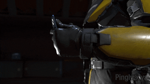 a man in a skull and crossbones helmet is wearing a smart watch