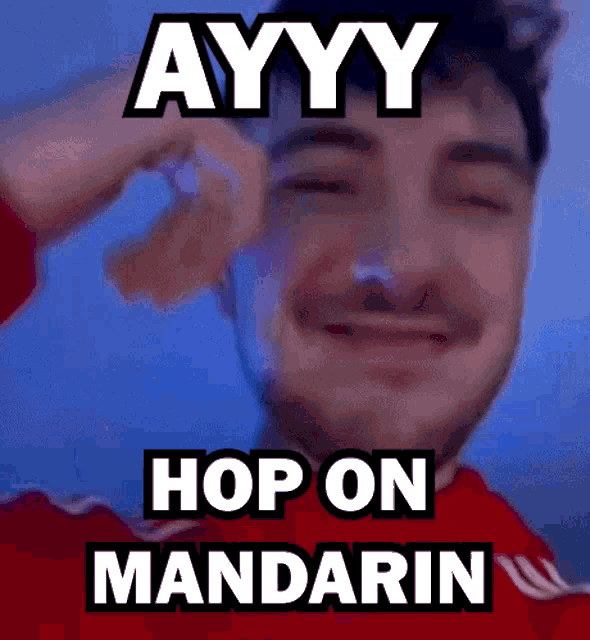 a man with a beard is making a funny face and says ayyy hop on mandarin .