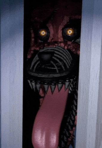 a monster with a long red tongue sticking out of its mouth