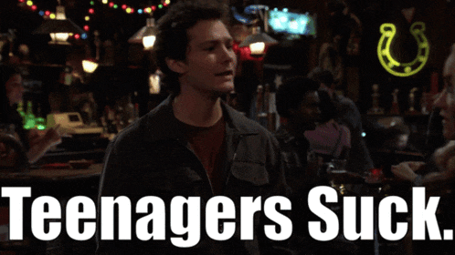 a man in a bar with the words " teenagers suck " on the bottom