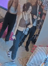 a group of people are posing for a picture in a room .