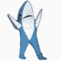 a blue and white stuffed shark is standing on its hind legs .