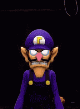 a cartoon character with a purple hat and a yellow letter g on it
