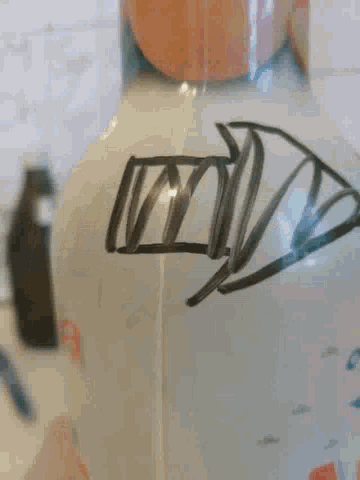 a drawing of a house is on a white surface