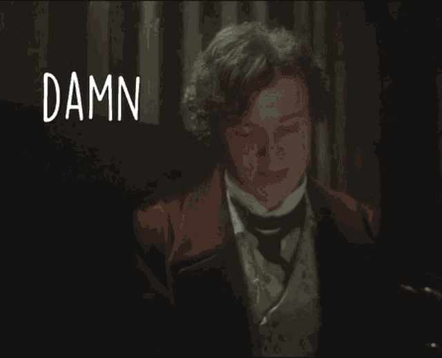 a man in a red jacket and tie says " damn your eyes " in white letters