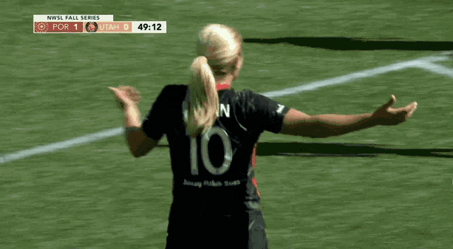 a female soccer player with the number 10 on the back of her jersey