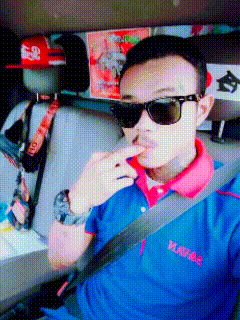 a man wearing sunglasses is sitting in a car
