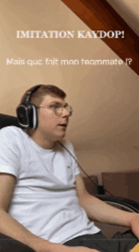 a man wearing headphones is sitting in front of a computer screen with the words imitation kaydop written above him