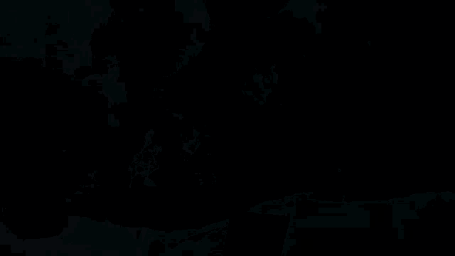 a pixelated image of a man standing in front of a huge explosion