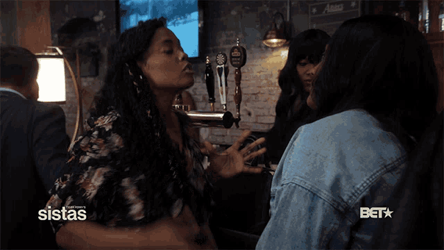 a bet advertisement for sistas shows two women fighting