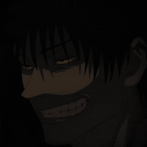 a close up of a person 's face in the dark with a smile on his face