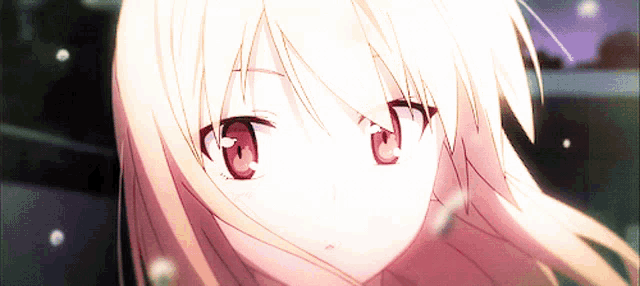 a close up of a girl 's face with pink eyes