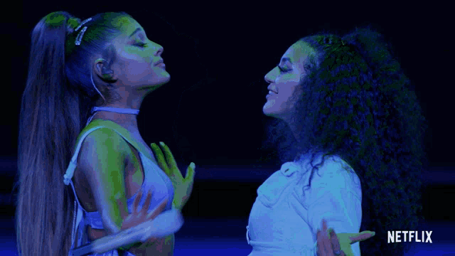 a netflix ad shows two women dancing in a dark room