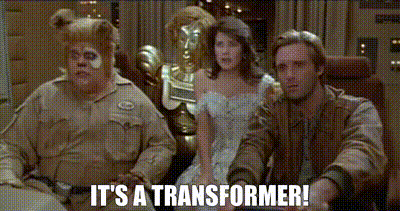 a group of people sitting next to each other with the words it 's a transformer written on the bottom