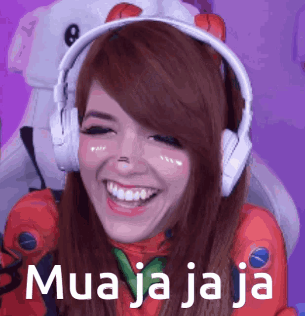 a woman wearing headphones is smiling and the words mua ja ja ja are on the purple background