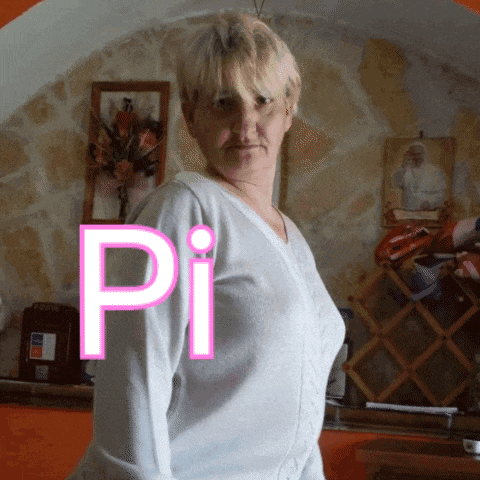 a woman in a white sweater is standing in front of a wall with pi written on it