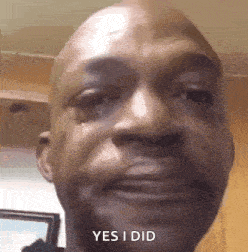 a bald man is crying with a tear coming out of his eye .
