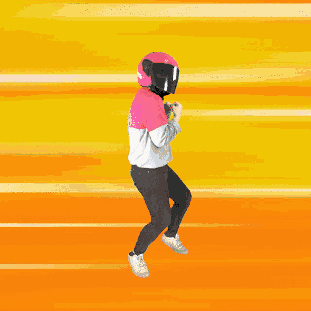 a person wearing a pink helmet and a pink shirt is running