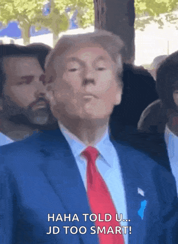 donald trump is wearing a blue suit and red tie