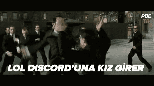 a group of men in suits are dancing in a street with the words lol discorduna kiz girer written in the corner
