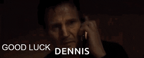 a man is talking on a cell phone with the words good luck dennis below him