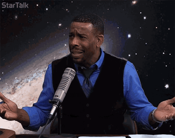 a man sitting in front of a microphone with startalk written on the bottom right
