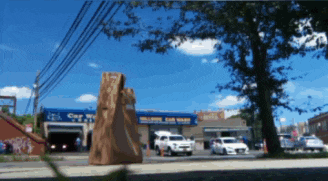 a car wash with a blue sign that says car wash on it