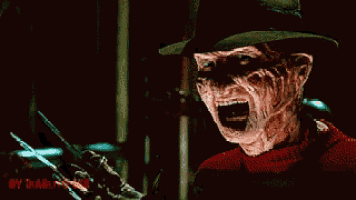 freddy krueger from a nightmare on elm street is holding a pair of scissors in his hand