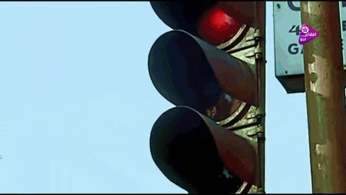 a close up of a red traffic light with a sign that says 40