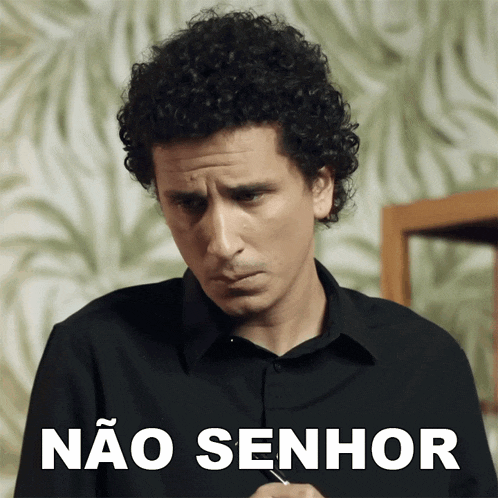 a man with curly hair has a sticker that says não senhor