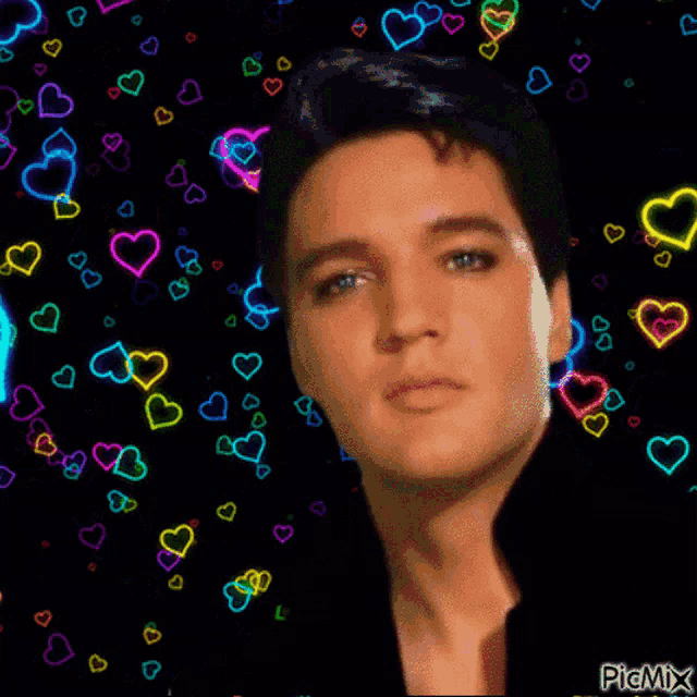 a picture of elvis presley is surrounded by colorful hearts on a black background