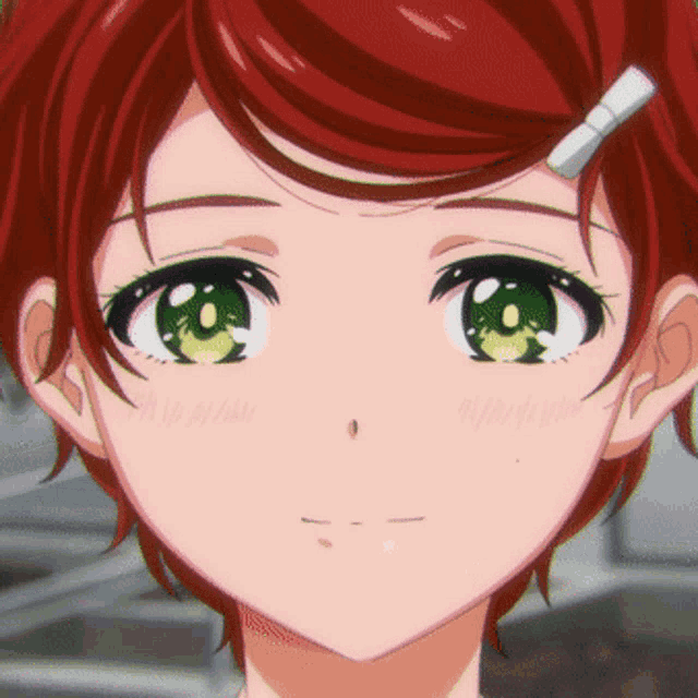 a girl with red hair and green eyes has a bow in her hair